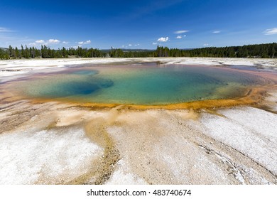 Turquoise Pool, a hot spring, with reflection in the Midway Geyser Basin of Yellowstone National Park, Wyoming