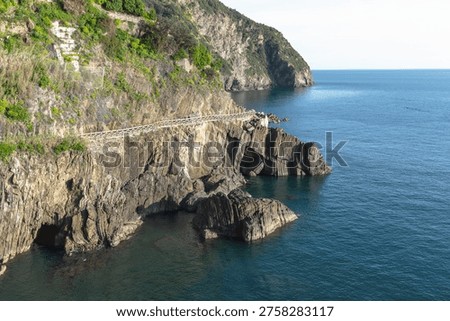 Turquoise sea and dramatic cliffs of Cinque Terre Via dell'Amore