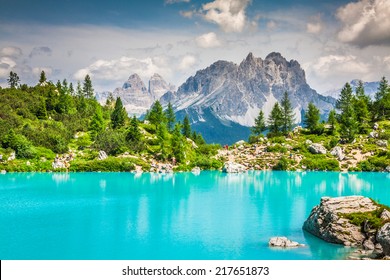 Turquoise Sorapis Lake  in Cortina d'Ampezzo, with Dolomite Mountains and Forest - Sorapis Circuit, Dolomites, Italy, Europe