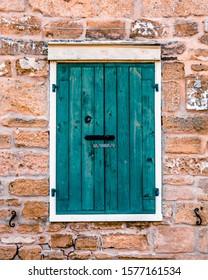 Turquoise Storm Shutters On Old Spanish Coquina House In Saint Augustine Florida