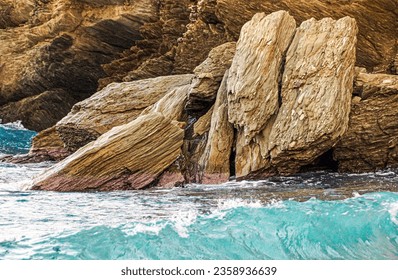 Turquoise water of the mediteranean sea in front of cliffs