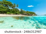 Turquoise water and white sand in a tropical beach. Seychelles, Indian Ocean