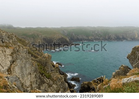 Turquoise waters of the Atlantic Ocean at the foot of the cliffs in Brittany - France