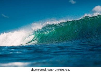 Turquoise wave in ocean. Breaking wave in sunny day - Powered by Shutterstock