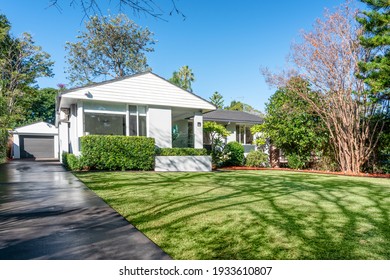 Turramurra, Sydney, Australia - Jun 14 2020: Front Garden Of Modern Suburban Home In Morning Light With Blue Sky, Mown Lawn, Driveway