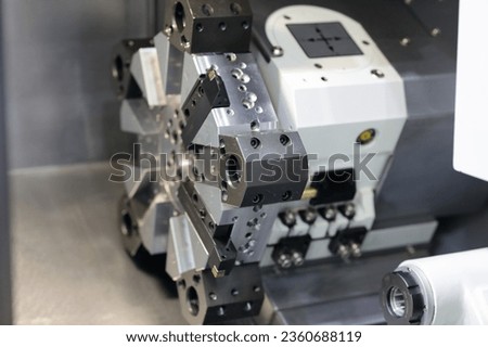 Turret head of metalworking CNC lathe machine. Selective focus.