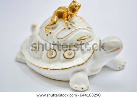 Turtle figurine with frog