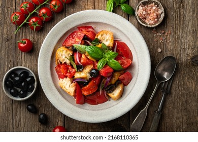 Tuscan Panzanella salad with tomatoes and bread, Italian cuisine dish, flat lay