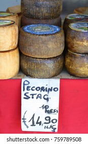 Tuscany, Italy - 09.21.2017: Tifferent Types Of Cheese For Sale At The Artisian Food Market: Pecorino, Parmesan, Mozzarella.