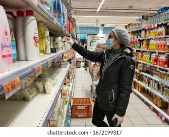 
Tuscany, Italy 2020-03-12 Coronovirus Panic: Shoppers Stocking Up On Essential Items. Woman At Supermarket With Mask