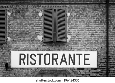 Tuscany, Italy. Italian Restaurant Sign On An Old Wall.