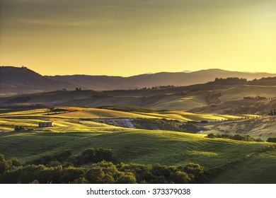 Tuscany spring, rolling hills on sunset. Rural landscape. Green fields. Italy, Europe - Powered by Shutterstock
