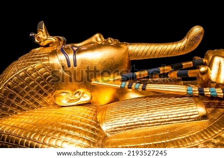 Tutankhamun's golden burial mask on black background. King Tut.