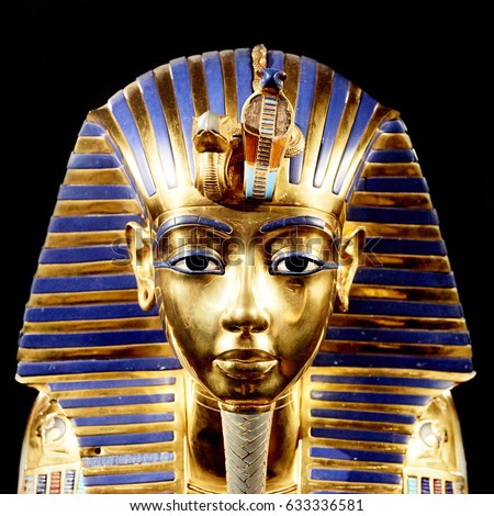 Tutankhamun's golden mask. Replica of funerary mask of Tutankhamun. Isolated on black background. The same or very similar to the original