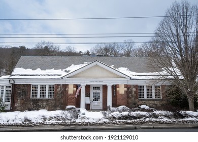 Tuxedo Park, NY - USA - Feb. 20, 2021: A Winter View Of The Historic Tuxedo Park Library, Built In The Center Of Town In 1901 By Bruce Price.