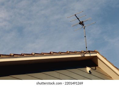 Tv Antenna And Alarm On House Roof