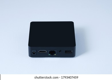 TV box black box. Side view of the connector panel. White background.