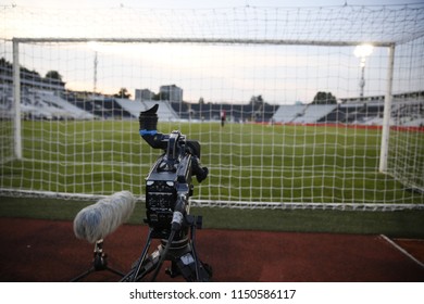 TV Camera Behind The Football Goal At The Stadium During Football Matches