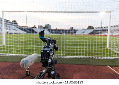 TV Camera Behind The Football Goal At The Stadium During Football Matches