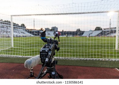 TV Camera Behind The Football Goal At The Stadium During Football Matches