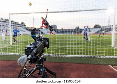 TV Camera Behind The Football Goal At The Stadium During Football Matches