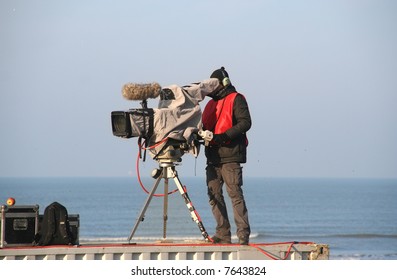 TV Camera Man Filming A Sports Match