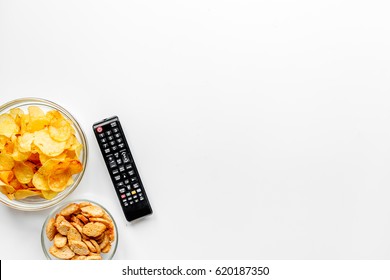 TV Control And Snacks On White Background Top View Space For Text