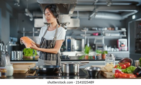 TV Cooking Show Kitchen: Asian Female Chef Talks About Ingredients, Teaches How To Cook Fish. Online Video Courses, Television Program. Healthy Traditional Dish Recipe Preparation