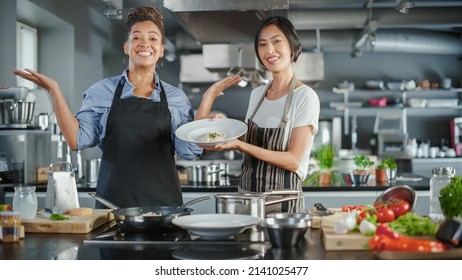 TV Cooking Show Kitchen With Two Master Chefs. Asian And Black Female Hosts Talk. Professionals Teach How To Cook Food, Taste Delicious Dish. Online Video Class Courses. Healthy Dish Recipe Prepare