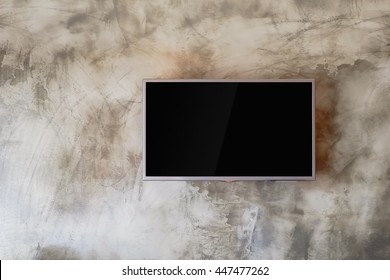 TV Flat Screen Lcd On The Cement Wall.