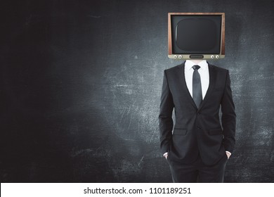 TV headed man standing on concrete wall background with copy space. Manipulation concept 