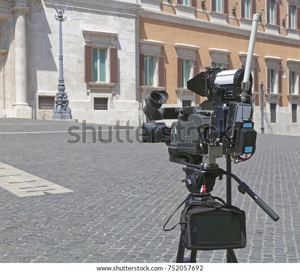TV News\
Camera With Portable Link and\
Reflector