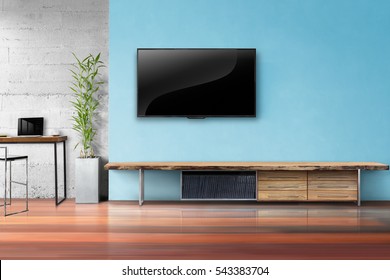 Tv On Light Blue Wall With Wooden Table And Plant In Pot Empty Living Room Interrior