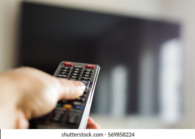 TV Remote Control, The Hand With A Remote Control.