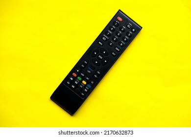 TV Remote Control, TV Tuner Or Audio System On A Yellow Background. Concept Series, Film, Flat Lay, Top View