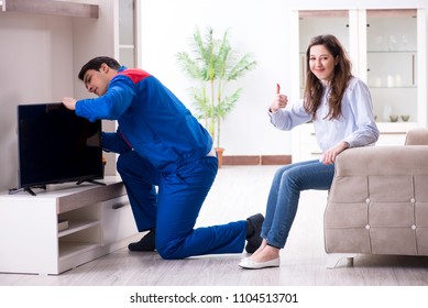 Tv Repairman Technician Repairing Tv At Home