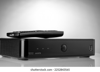 TV set-top box prepared for installation, digital TV kit on white background close-up with reflection. High quality photo - Shutterstock ID 2252843565