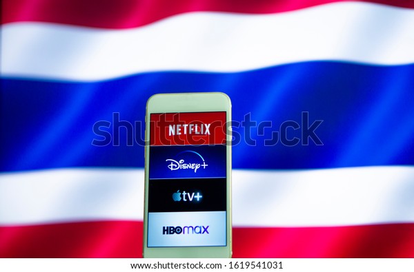TV streaming logo,  Netflix,\
disney plus, Amazon Prime, Hulu, HBO Mex, Apple TV Plus on Phone\
with Thailand flag background t.  Bangkok, Thailand 19 January\
2020
