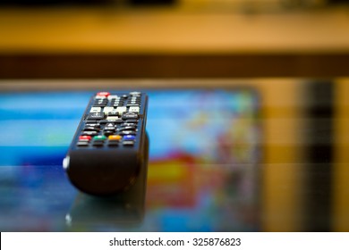 TV (television) Remote On The Glass Table (color Toned Image)