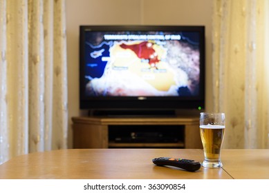 TV, Television Watching (map Of Near East) With Feet On The Table - Stock Photo