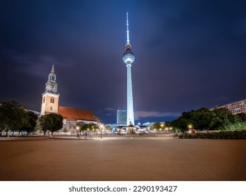 TV Tower (Fernsehturm) and St. Mary Church at night - Berlin, Germany - Powered by Shutterstock