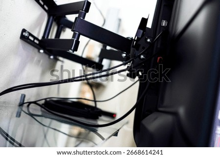 TV wall mount bracket installation with cables