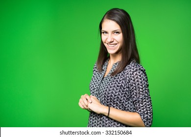  TV Weather News Reporter At Work.News Anchor Presenting The World Weather Report.Television Presenter Recording In A Green Screen Studio.Young Woman With Copy Space On Green Screen Chroma Key