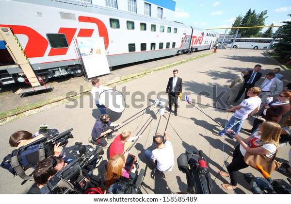 TVER - JUN 05: Journalists interviewed director\
of the Tver Carriage Works about a two storey passenger car, on\
June 05, 2013 in Tver,\
Russia.
