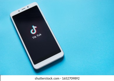 Tver, Russia - February 12, 2020; Tik Tok Logo On Smartphone Screen On Blue Background. Tik Tok Icon. Tik Tok Application. Tiktok Social Media Network. Space For Text.