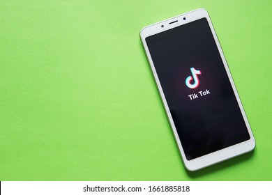 Tver, Russia - February 12, 2020; Tik Tok Logo On Smartphone Screen On  Green Background. Tik Tok Icon. Tik Tok Application. Tiktok Social Media Network. Space For Text.