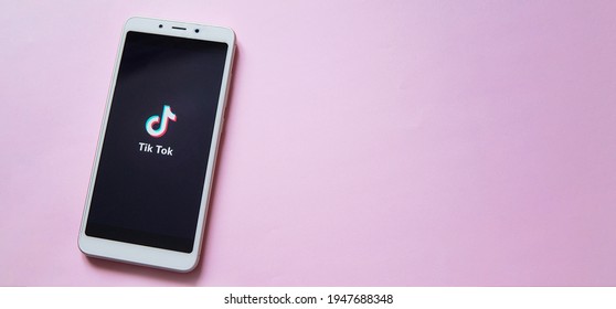 Tver, Russia - February 12, 2020 Tik Tok Logo On Smartphone Screen On Pink Background. Tik Tok Icon. Tik Tok Application. Tiktok Social Media Network. Space For Text.