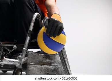 TVolleyball.he Man On The Sports Wheelchair With The Ball 