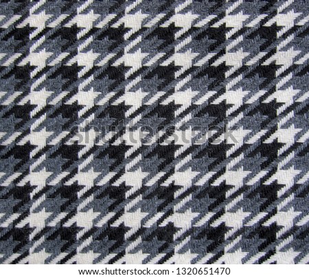 Tweed fabric houndstooth texture, wool pattern close up, woven textile background