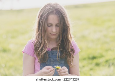 Tween Girl With Daisy